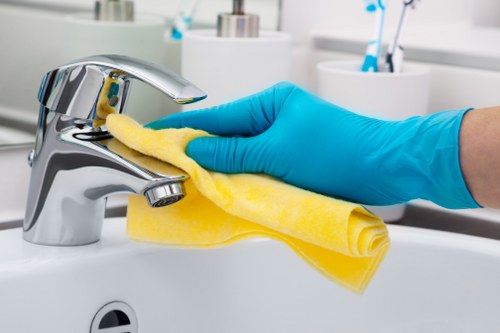 Technician applying trained cleaning methods with care in a room interior