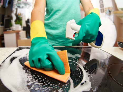 Technician applying cleaning solution with care