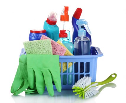 Technician treating stained upholstery during sofa cleaning in Enfield